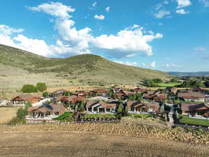 View of mountain backdrop featuring nearby suburban area