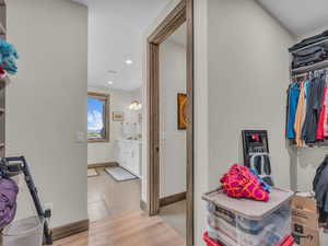 Walk in closet featuring light wood-style floors