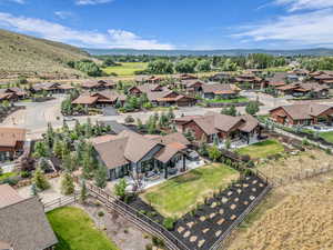 Aerial perspective of suburban area featuring a mountainous background