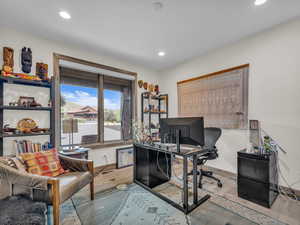 Office featuring wood finished floors and recessed lighting