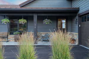 Doorway to property with covered porch