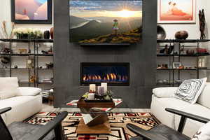 Living area with a tiled fireplace