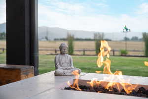 Detailed view of a fire pit and a mountain backdrop