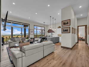 Living room featuring light wood finished floors and recessed lighting