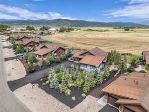 Overview of rural landscape featuring a mountain backdrop