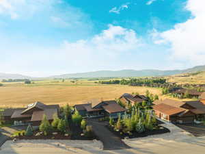 View of mountain backdrop with rural landscape