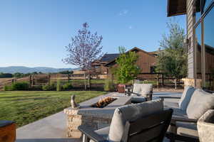 View of patio / terrace featuring an outdoor living space with a fire pit