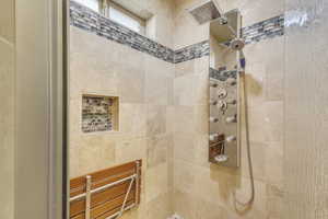 Master bath with a tile shower