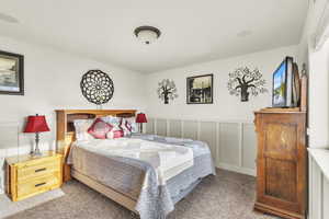 Jr Suite bedroom #2 with wainscoting and a decorative wall, Bathroom Attached