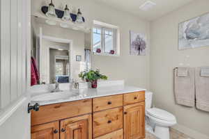 Jr Suite Bathroom featuring toilet, shower and vanity