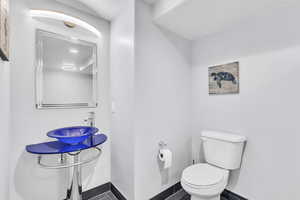 Bathroom featuring toilet and a sink