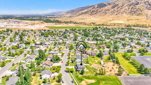 Aerial perspective of suburban area featuring a mountainous background