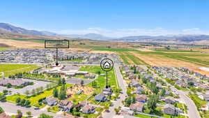 Aerial view of residential area featuring mountains