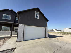 Garage featuring driveway