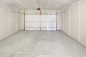 Garage featuring a garage door opener