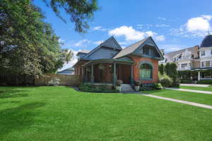View of front of house featuring brick siding and covered porch