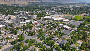 Aerial view of property and surrounding area with mountains