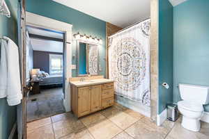 Full bathroom featuring vanity and ensuite bathroom
