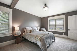 Owner's bedroom featuring carpet floors and multiple windows