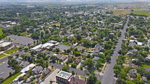Aerial view of property's location with nearby suburban area