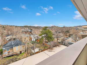 Balcony featuring a mountain view and a residential view