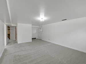 Spare room with light colored carpet