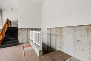 Stairway featuring concrete floors