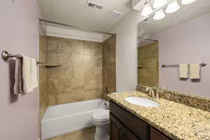 Full bath with vanity and tub / shower combination