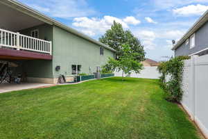 Fenced backyard featuring a patio