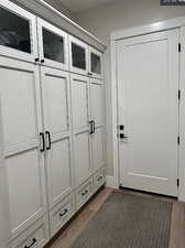 Mudroom featuring dark wood-style floors