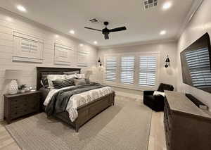 Bedroom featuring light wood-type flooring, crown molding, recessed lighting, and ceiling fan