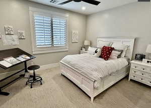 Carpeted bedroom with ceiling fan and recessed lighting