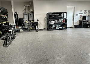 Garage featuring gas water heater