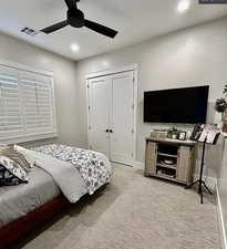Bedroom with carpet flooring, recessed lighting, a closet, and ceiling fan