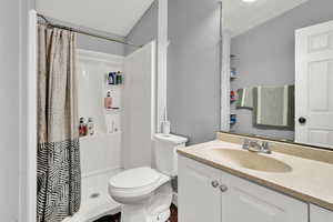 Bathroom with vanity and a shower stall