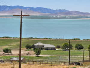 Water view with rural landscape and mountains