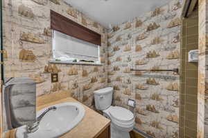 3/4 bathroom featuring vanity and toilet