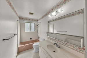 Full bath with shower / tub combination and vanity