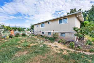 Rear view of house featuring a mountain view