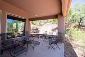View of patio with outdoor dining area