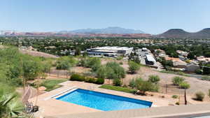 View of swimming pool with a mountain view