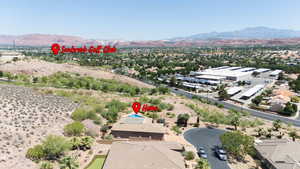 Aerial view of residential area featuring a mountain backdrop