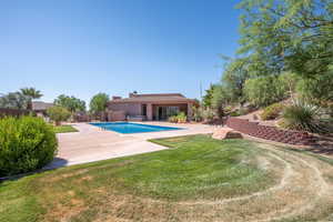 View of swimming pool with a patio area