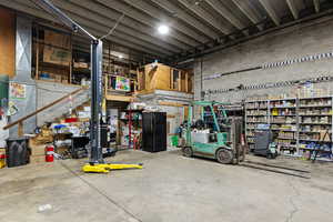 Garage featuring freestanding refrigerator