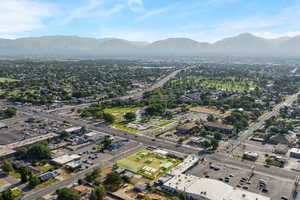 Aerial overview of property's location with property parcel outlined and a mountainous background
