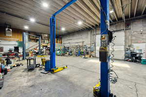 Garage with a workshop area and a heating unit