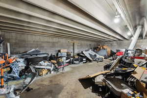 Garage featuring concrete block wall
