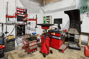 Garage featuring concrete block wall