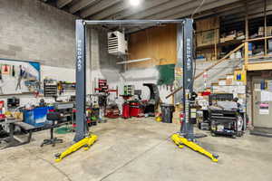 Garage with a workshop area and a heating unit