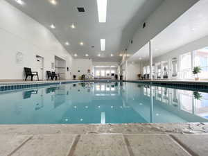Indoor pool featuring a skylight